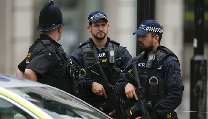 London police officials can be seen in this image. — AFP/File
