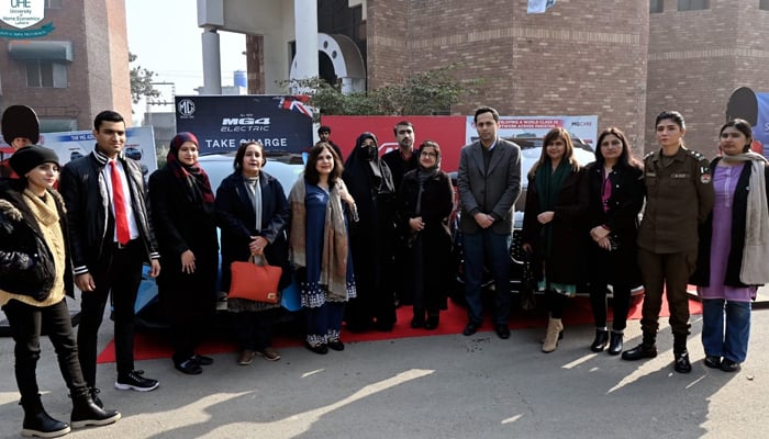 Participants pose during the inaugural auto exhibition, spotlighting an array of eco-friendly vehicles ceremony on January 26, 2024. — Facebook/University of Home Economics Lahore