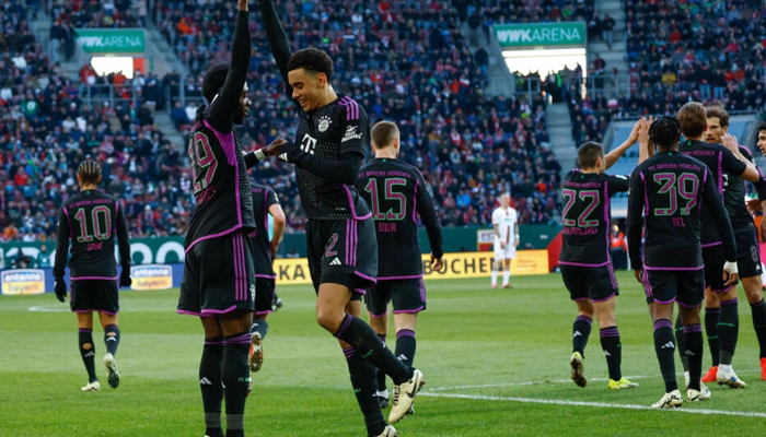 Bayern Munichs Alphonso Davies (left) celebrates scoring his teams second goal. — AFP/File