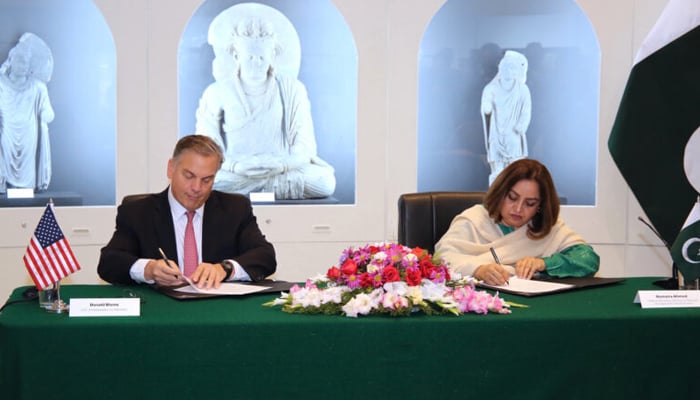 Ambassador Donald Blome and Secretary Humaira Ahmed can be seen while signing a cultural property agreement in Islamabad on January 30, 2024. — U.S. Embassy & Consulate in Pakistan Website