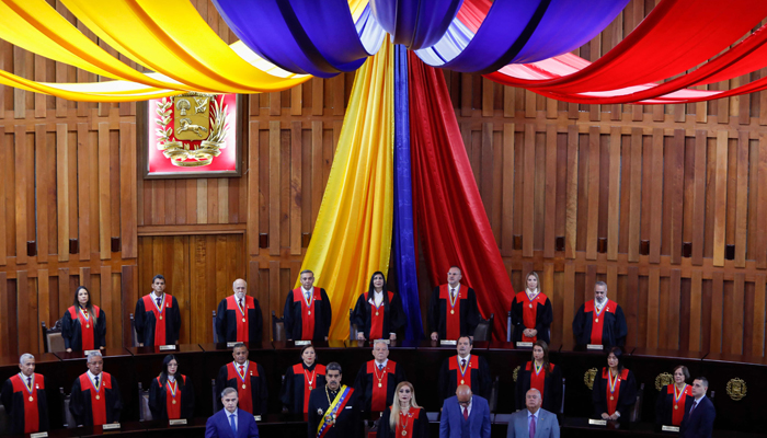 (First row, L to R) The AG Venezuela, Tarek William Saab, President Nicolas Maduro, President of the Supreme Court of Justice, Caryslia RodrÃ­guez, the president of the National Assembly, Jorge RodrÃ­guez, and the president of the CNE, Elvis Amoroso, attend the inauguration ceremony of the judicial year at the Supreme Court of Justice building in Caracas on January 31, 2024. — AFP