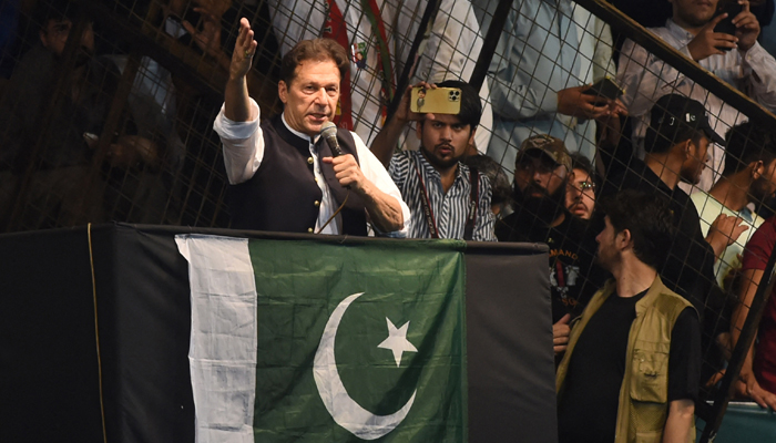 Former Prime Minister and Pakistan Tehreek-e-Insaf party (PTI) founding chief Imran Khan, delivers a speech to his supporters during a rally to celebrate the 75th anniversary of Pakistans independence day in Lahore on August 13, 2022. — AFP