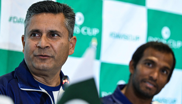 Indias coach Zeeshan Ali (L) speaks to the media before the draw ceremony of the Davis Cup World Group I play-offs between Pakistan and India, in Islamabad on February 2, 2024. — AFP