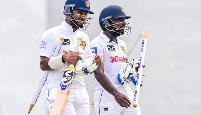 Sri Lankan Cricketers Dimuth Karunaratne (left) and Nishan Madushka (right) can be seen in this image. — AFP/File