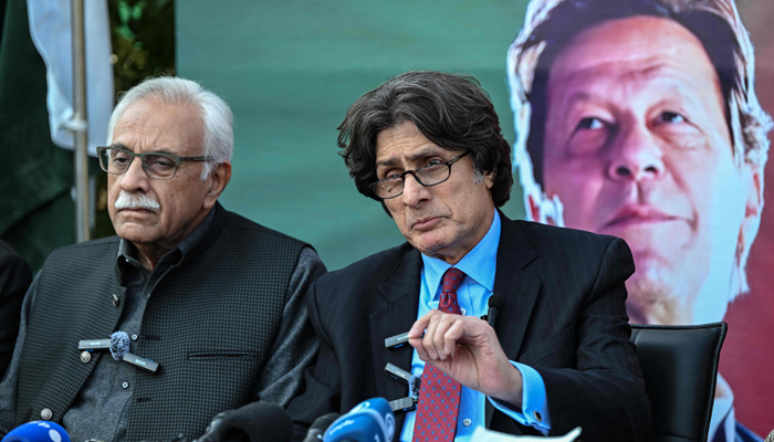 Leaders of Pakistan Tehreek-e-Insaf (PTI) party Raoof Hasan along with Ahmad Awais (L) speaks during a press conference in Islamabad on February 6, 2024. — AFP