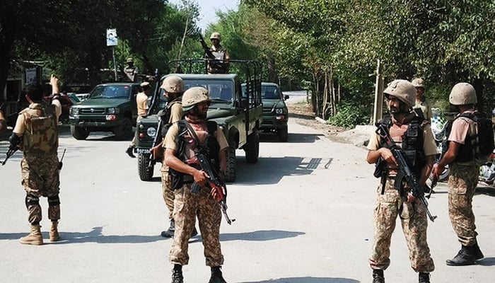 In this representational file photo, Pakistani soldiers cordon off a street leading to the outskirts of Peshawar on September 2, 2016. — AFP