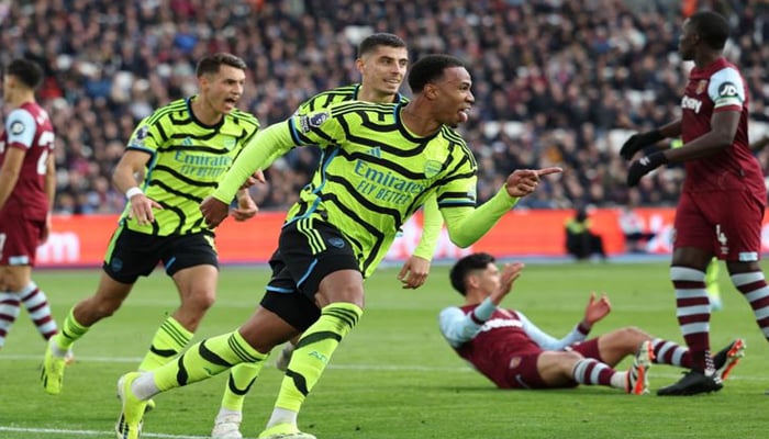 Arsenals Brazilian defender Gabriel Magalhaes (centre) celebrates with teammates after scoring their third goal against West Ham United during the English Premier League match at the London Stadium on February 11, 2024. — AFP