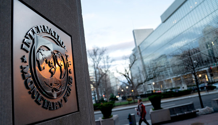 The seal for the International Monetary Fund is seen near the World Bank headquarters (R) in Washington, DC on January 10, 2022. — AFP