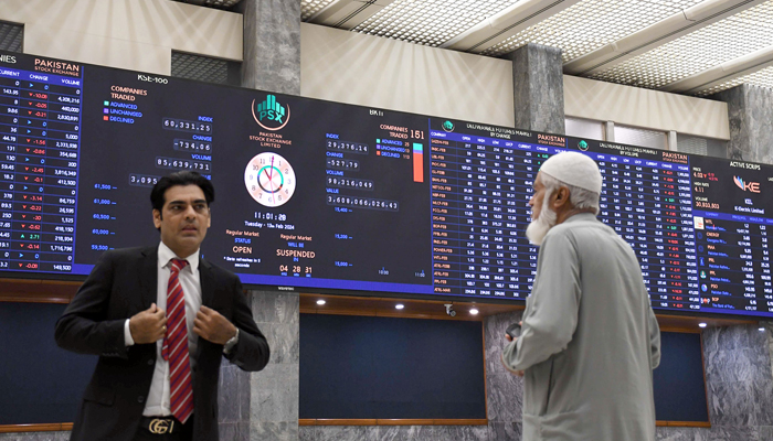 Stock brokers watch share prices during a trading session at the Pakistan Stock Exchange (PSX) in the Provincial Capital on February 13, 2024. — Online