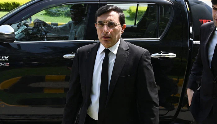 Pakistan Tehreek Insaf Chairman Barrister Gohar Ali Khan can be seen outside the Islamabad High Court on August 8, 2023. — AFP