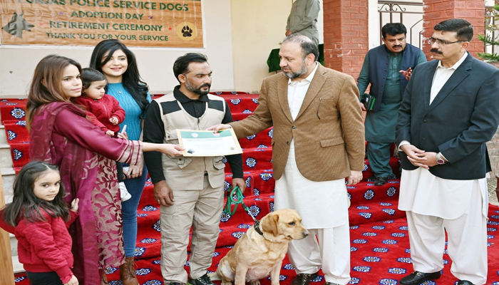 Additional IG Special Branch Zulfiqar Hameed can be seen distributing certificates at the special ceremony organized for the adoption of six retired sniffer dogs of Punjab Police on February 16, 2024. — Facebook/Punjab Police Pakistan