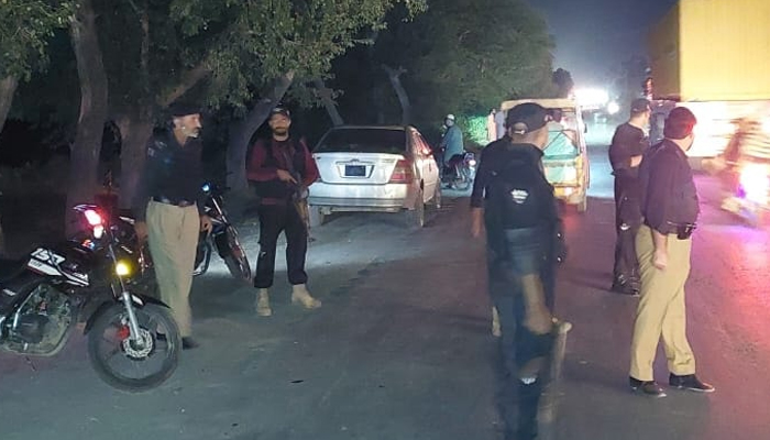 KPK police stand guard on the road of Nowshera on October 13, 2023. — Facebook/Nowshera Police