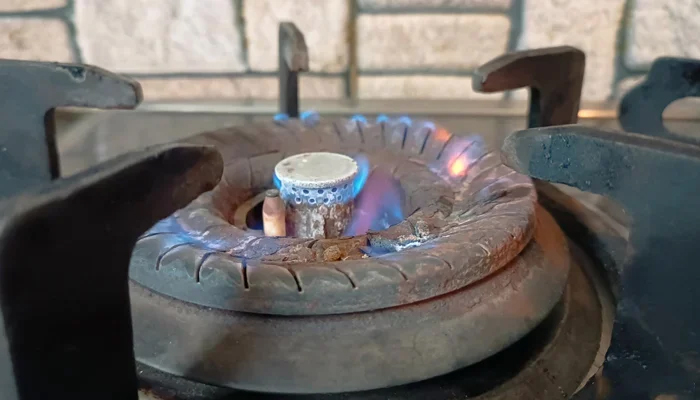 This image shows a low gas flame due to a low gas pressure in a household in Karachi. — Geo.tv/Saad Aalam Angaria/File