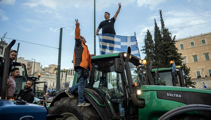Greek farmers take part in a protest to demand financial aid in front of the Parliament in Athens on February 20, 2024. — AFP