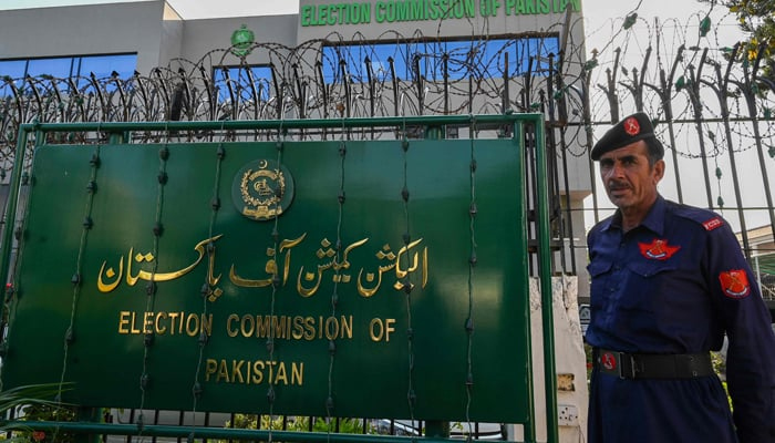 A security personnel stands guard at the headquarters of the Election Commission of Pakistan in Islamabad on September 21, 2023. — AFP