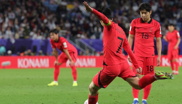 South Koreas midfielder Son Heung-min (number 7) shoots to score his teams second goal during the Qatar 2023 AFC Asian Cup quarter-final football match between Australia and South Korea on February 2, 2024. — AFP