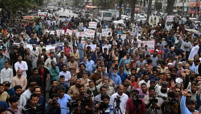 Traders shout slogans during a protest at a street in Karachi, August 23, 2023, against the surge in petrol and electricity prices as Pakistan endures soaring inflation. — AFP/File