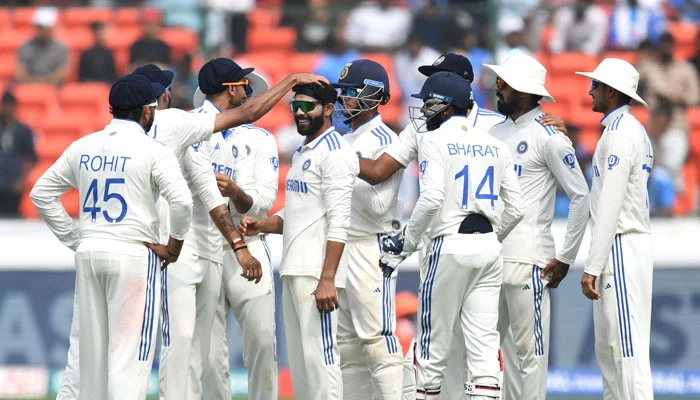 Indian players celebrate after taking a wicket. — AFP/File