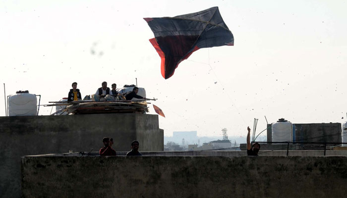 Youths are flying kites as they celebrate the Basant Festival to welcome Spring Season, at Sadiqabad in Rawalpindi on February 23, 2024. — PPI