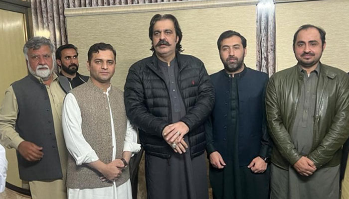 Khyber Pakhtunkhwa Chief Minister-designate Ali Amin Khan Gandapur (C) posses along with party workers and including scholars and lawyers, at the Speaker’s House on February 25, 2024. — Facebook/Ali Amin Khan Gandapur