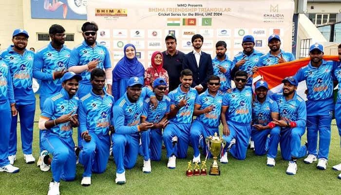 Indian blind team can be seen with the winning trophy. — DNA Website/File