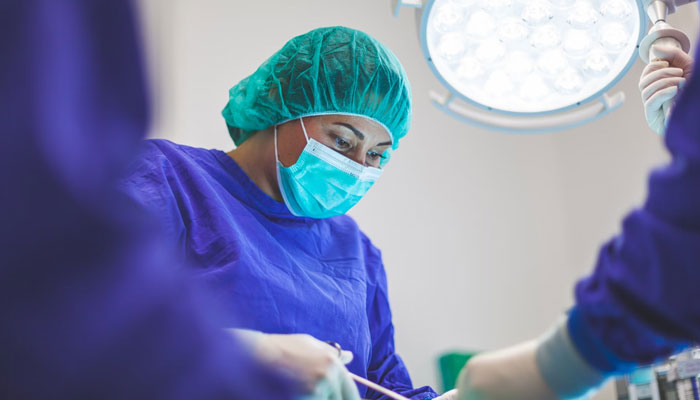 A representational image of a doctor performing surgery. — Unsplash