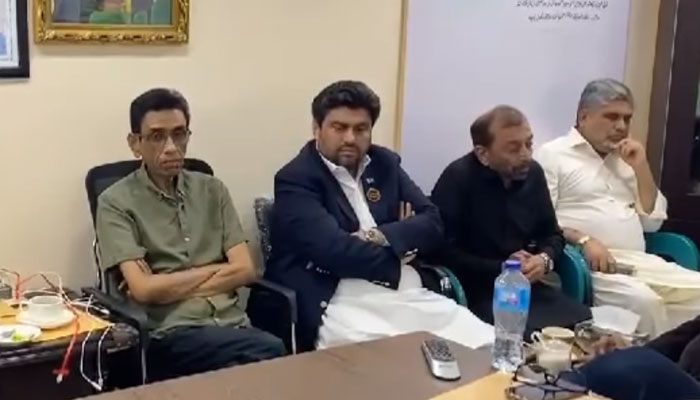 In this screengrab MQM-P convener Dr Khalid Maqbool Siddiqui (L) sits along with Sindh Governor Kamran Tessori (L to R) Dr Farooq Sattar (R to L), deputy conveners Anis Qaimkhani (L) at the party’s Bahadurabad office on February 25, 2024. — Facebook/Syed Mustafa Kamal