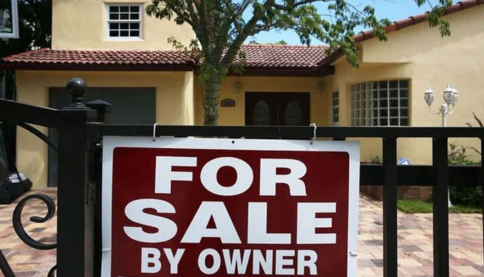 A For Sale sign is seen in front of a home on August 21, 2015 in Miami, Florida. — AFP File