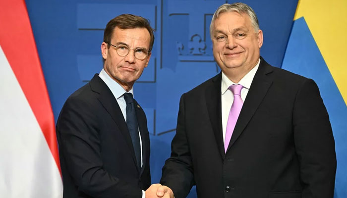 Swedish Prime Minister Ulf Kristersson (left) meets Hungarian counterpart Viktor Orban on February 23, 2024. — AFP