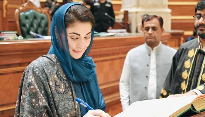 Punjab’s chief minister-elect Maryam Nawaz while signing a yellow book in the Punjab Assembly on February 23, 2024. — Facebook/Maryam Nawaz Shari