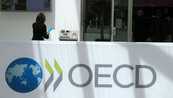 This image shows the logo of the OECD outside its headquarters in Paris. — AFP