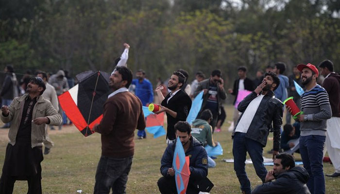 Pakistani kite flyers fly kites at a park in Islamabad. — AFP/ File