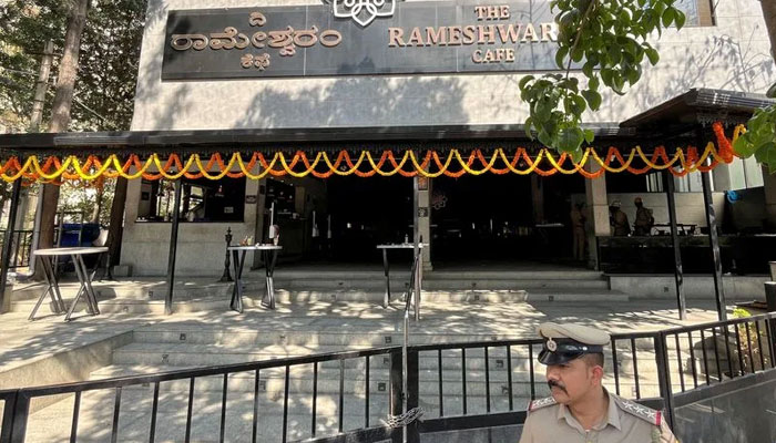 A police officer stands guard after a blast at a popular cafe in technology hub of Bengaluru. — AFP File