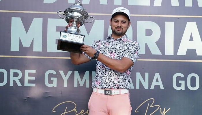 Ahmed Baig lifts the J. A. Zaman Memorial Open Golf Championship trophy in Lahore on March 3, 2024. — Facebook/.A.Zaman Memorial Golf Tournament