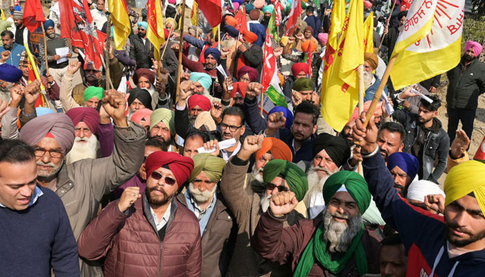 Farmers shout slogans during a protest demanding higher crop prices in Amritsar on February 13, 2024. — AFP