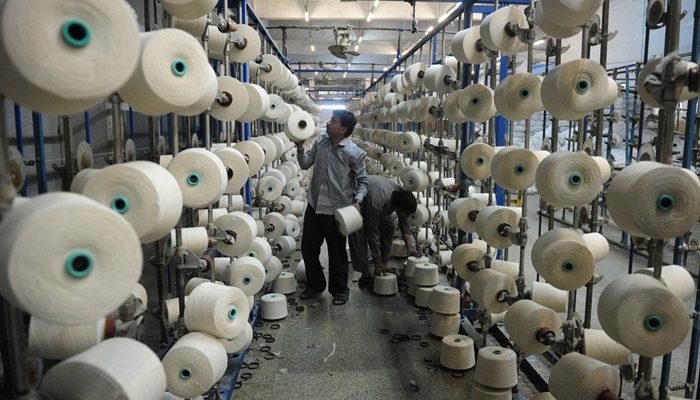 In this image, a man can be seen working in a textile factory in Pakistan. — AFP/File