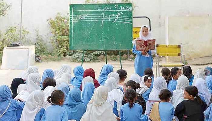 The undated image shows female students studying in an open-air classroom. — TNS/File