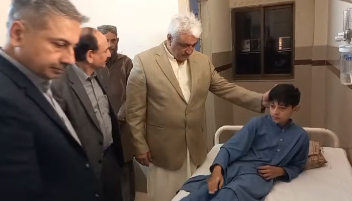 In this still Minister of Specialised Healthcare and Medical Education Department Khawaja Salman Rafique meets with 14-year-old Farzan who was being treated there for a tumour at  Childrens Hospital Lahore on March 9, 2024. — Facebook/Khawaja Salman Rafique