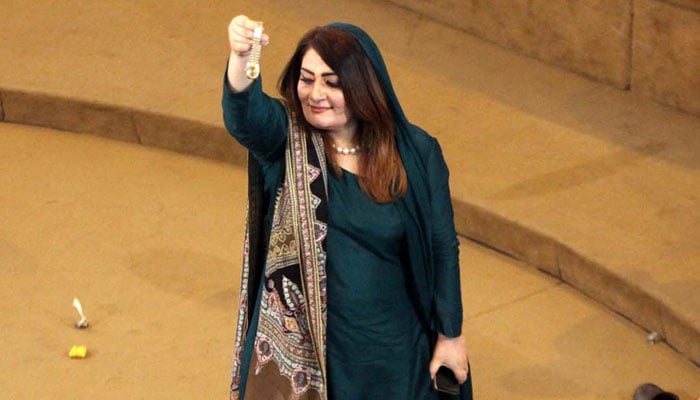 Pakistan Muslim League Nawaz (PML-N) lawmaker Sobia Shahid waving a wristwatch during the first session of the KP Assembly in Peshawar on Wednesday, February 28, 2024. — PPI