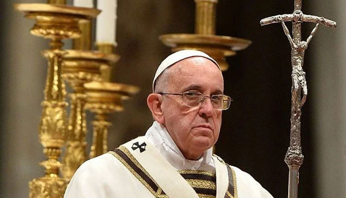 Pope Francis looks on during a religious ceremony, ritual in a church. — AFP/File