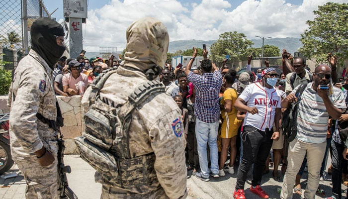 Police look on as Haitian citizens gather in front of the US Embassy in Tabarre, Haiti. — AFP/File