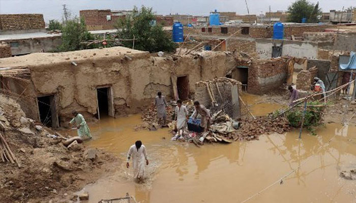Residents clear debris of a damaged house due to a heavy monsoon rainfall on the outskirts of Quetta, Balochistan, Pakistan on July 5, 2022. —AFP/File