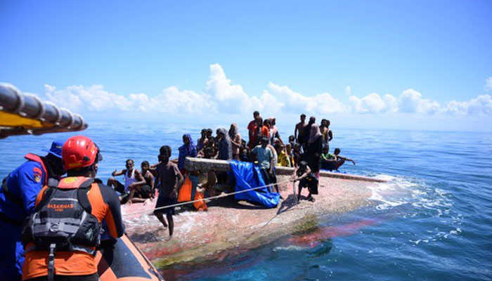 Rohingya refugees are rescued from their capsized boat by National Search and Rescue Agency personnel in waters some 16 nautical miles (18 miles) off West Aceh, Indonesia, March 21, 2024.—AFP