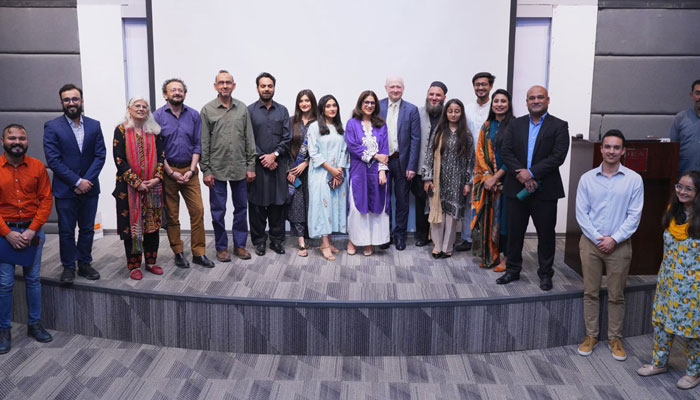 Participants possess a group photo at the Centre for Excellence in Journalism in IBA Karachi on March 27, 2024. —  Institute of Business Administration Karachi Website