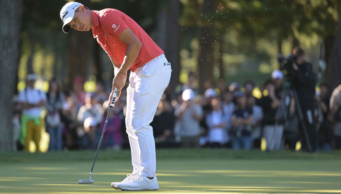 Collin Morikawa of the US putts for a birdie on the 15th green during the final round of the Zozo Championships PGA golf tournament at the Narashino Country Club in Inzai, Chiba prefecture on October 22, 2023. — AFP