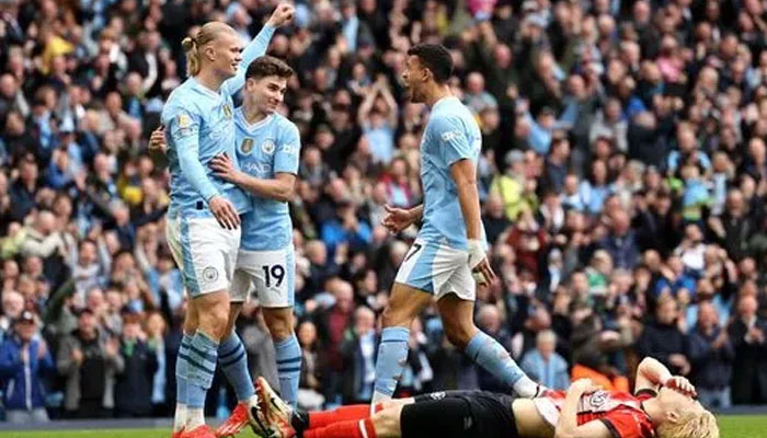 Erling Haalands double secures Manchester Citys win in Premier League match. (Erling Haaland celebrates opening the scoring for Manchester City against Luton on April 14, 2024. — Manchester Evening website