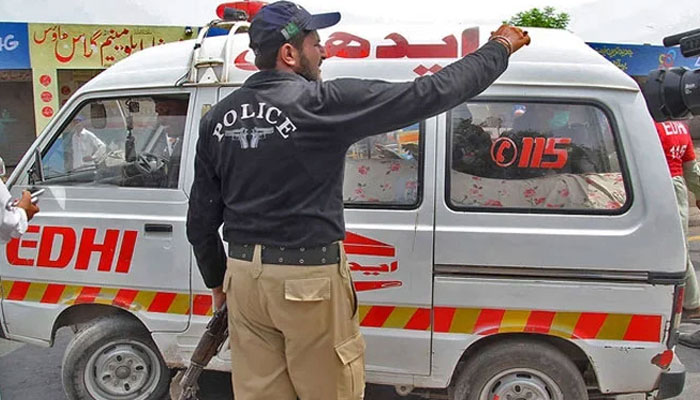 This undated image shows an Edhi ambulance with police personnel making a way. — AFP/File