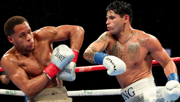 Ryan Garcia (right) punches Devin Haney on the way to a majority decision victory in their super-lightweight bout in Brooklyn, New York. — AFP/File