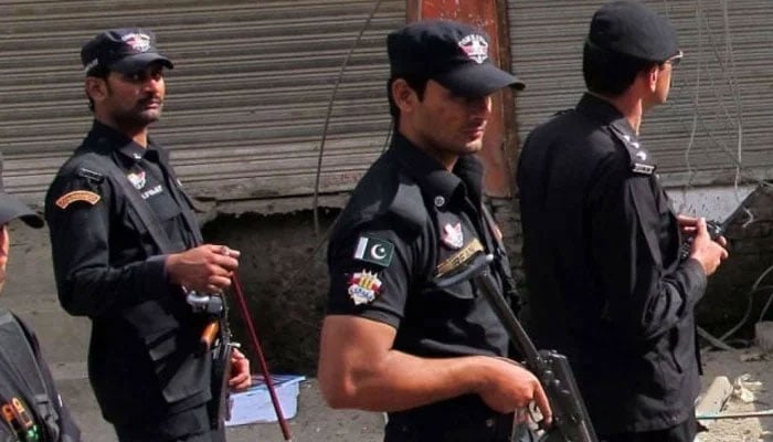 KP Police personnel patrol area after an attack in Swat. — AFP