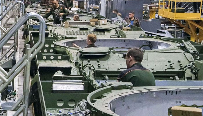 Factory workers assemble tanks at a weapons factory in Russia. — AFP/File